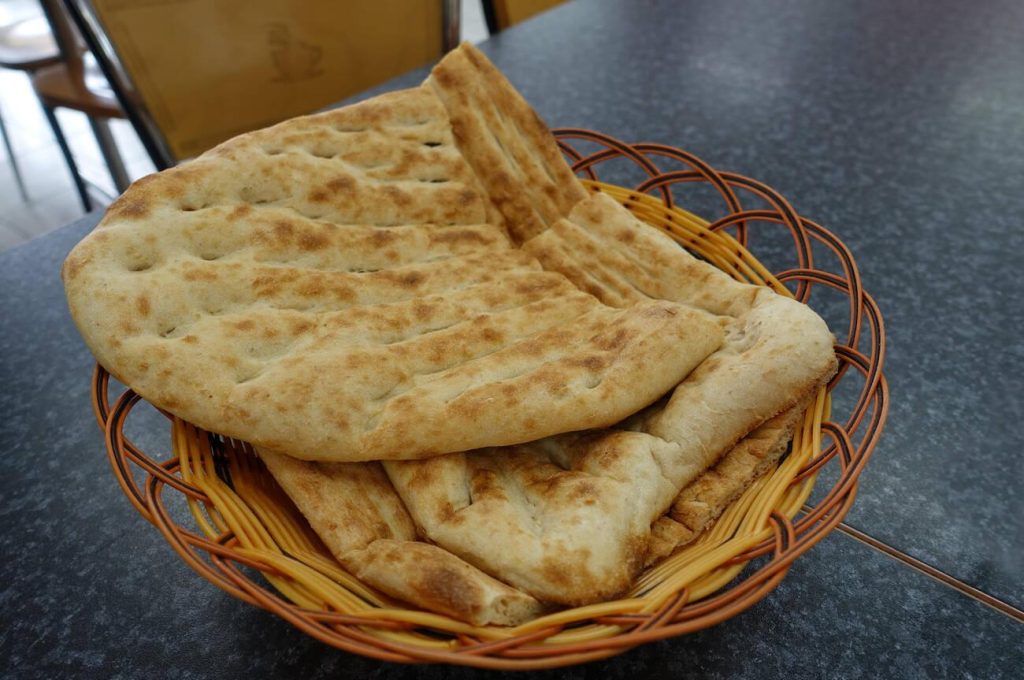 Afghan Naan bread in wooden basket