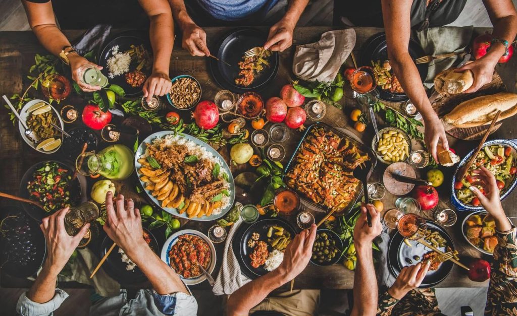 A vibrant and abundant Turkish food feast spread across a table, featuring a variety of colorful meze, salads, and breads, showcasing the generous traditions of Turkish cuisine.