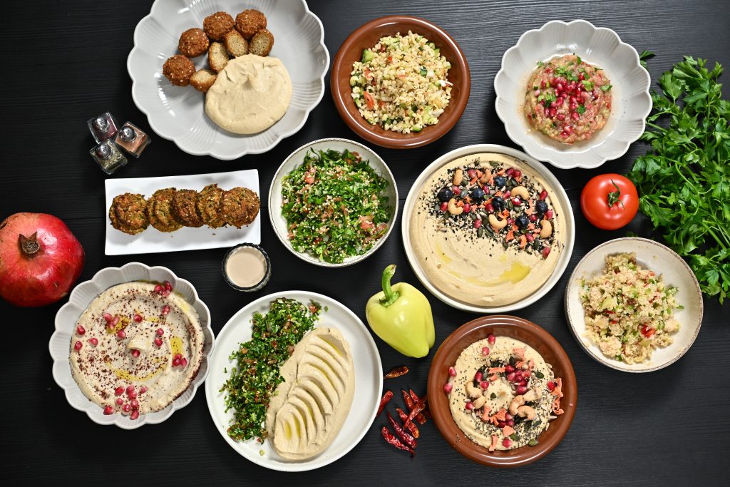 Various food bowls on black table