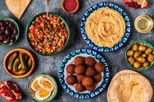 Falafel and hummus - traditional dish of Israeli and Middle Eastern cuisine, top view.
