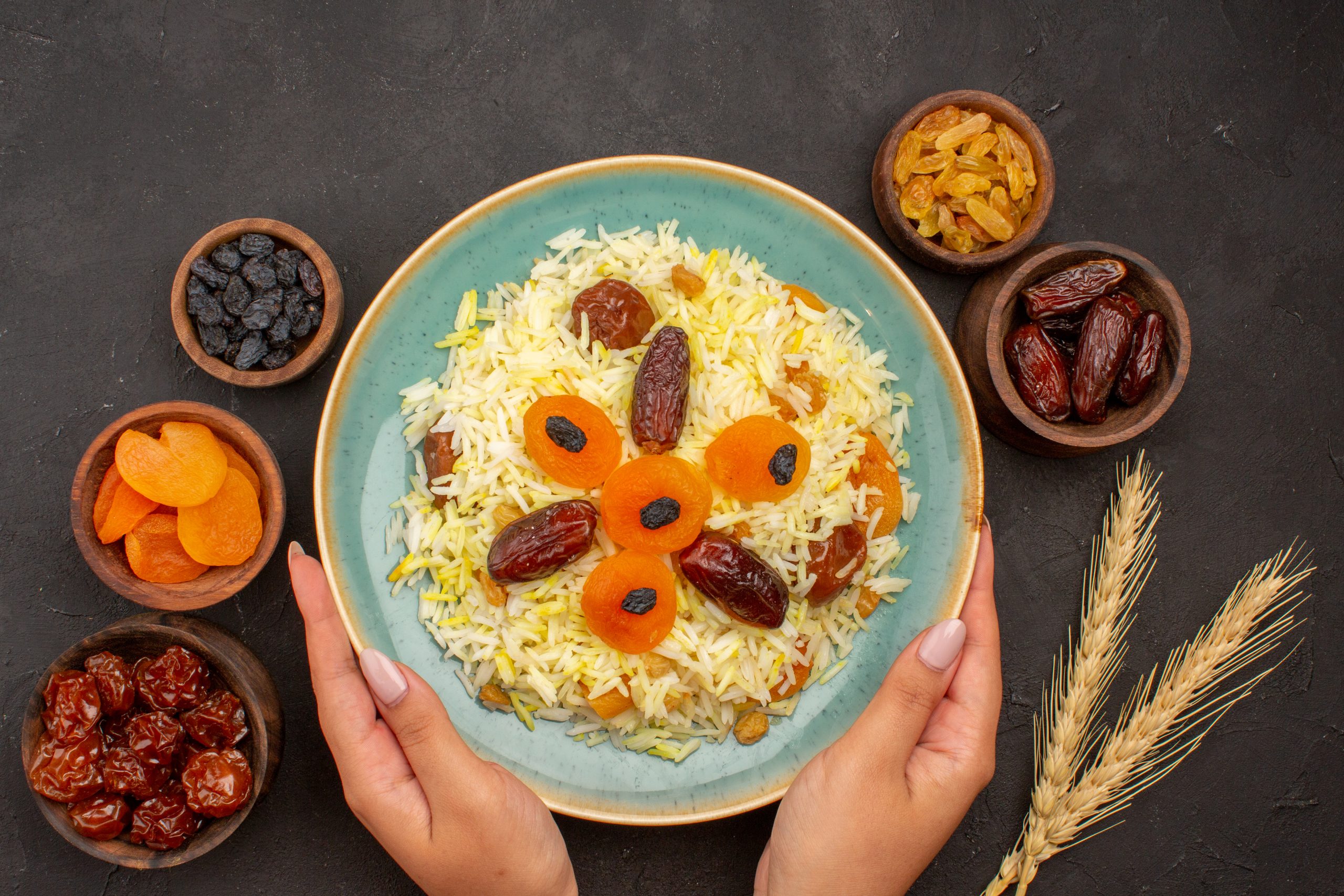 top view delicious cooked plov rice with different raisins inside plate on grey background rice meal food cooking dinner raisin