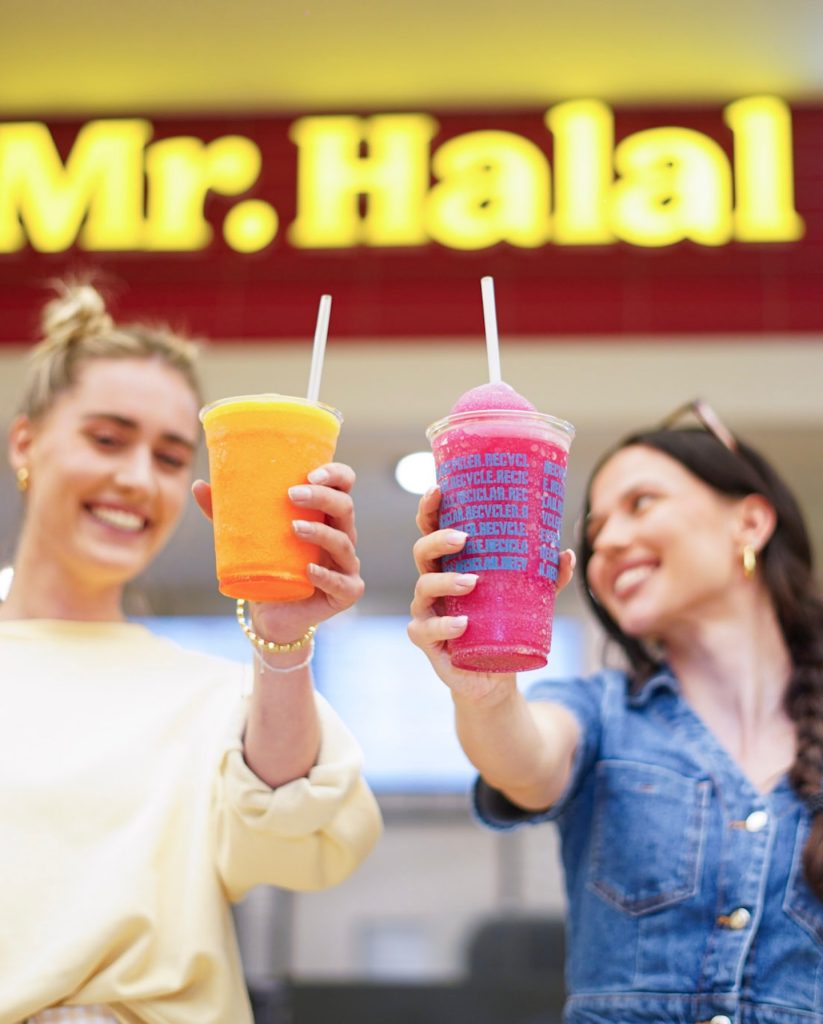 2 customers enjoying a milkshake at Mr. Halal Burger