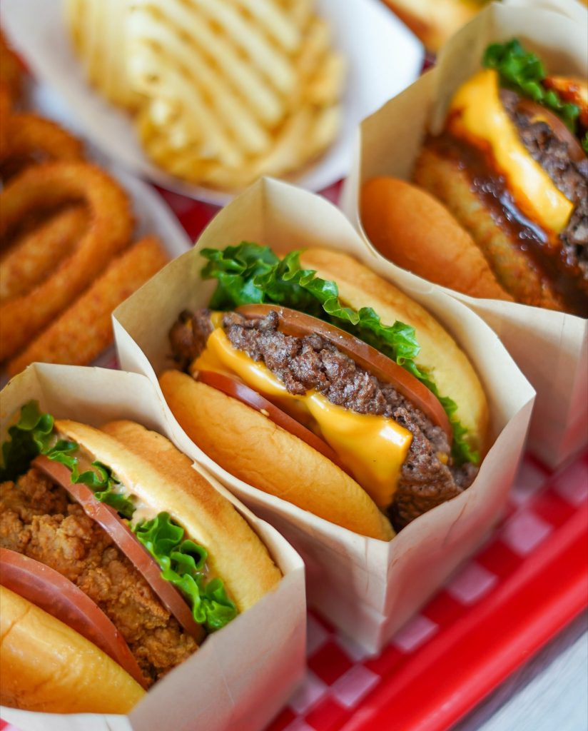 Mr. Halal Burger Multiple trays of burgers shots