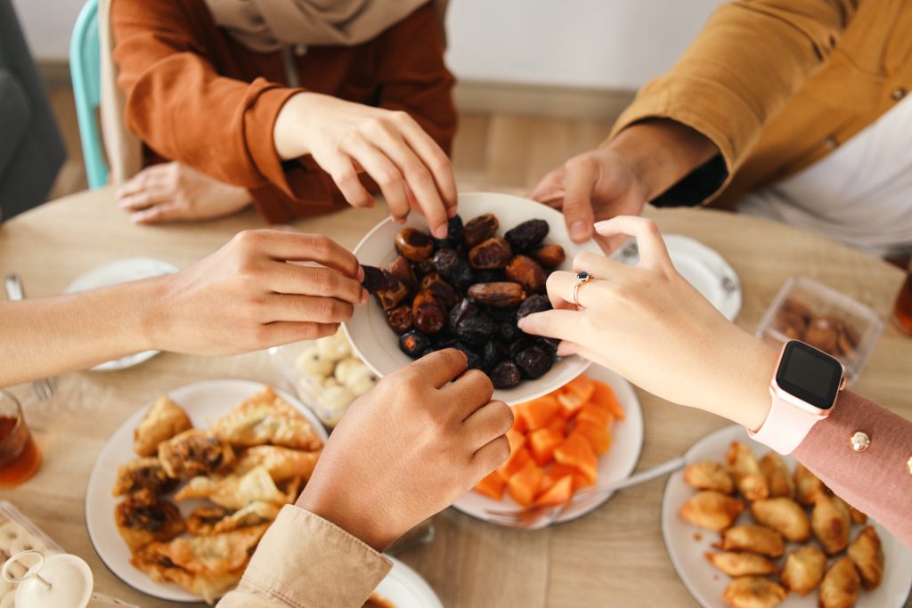 hands-of-muslim-people-taking-dates-fruit-on-iftar