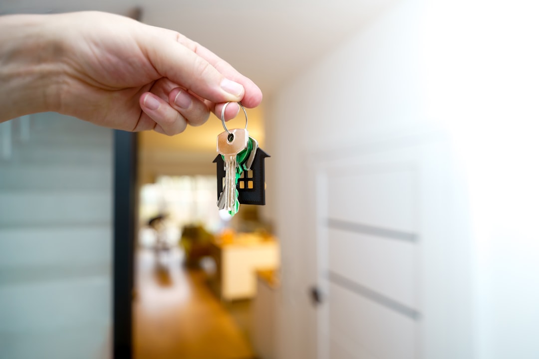 New home key being handed over inside a home