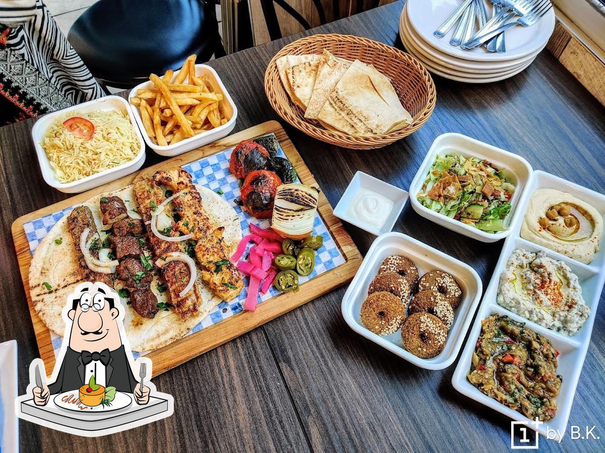 Levantine Mediterranean dishes including grilled meat, hummus, falafel, rice and bread