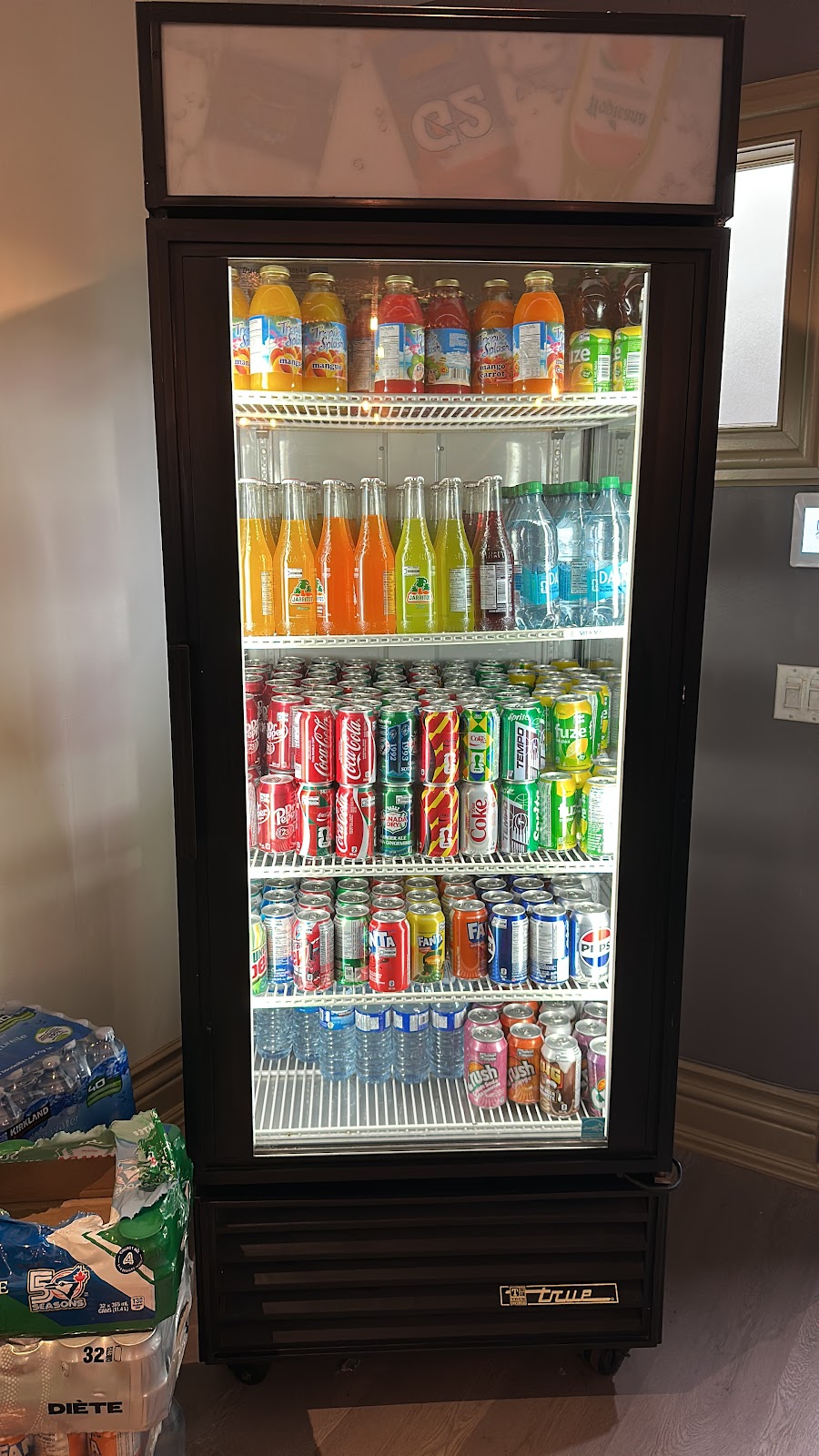 Restaurant interior and beverage selection at Unika Kebab
