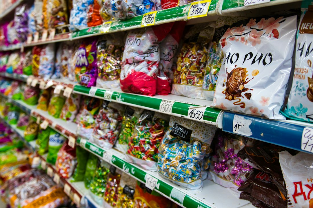 Candy and snack shelves Colourful candy and snack packages on grocery shelves