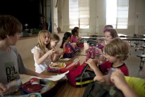 Students eating lunch in a school cafeteria