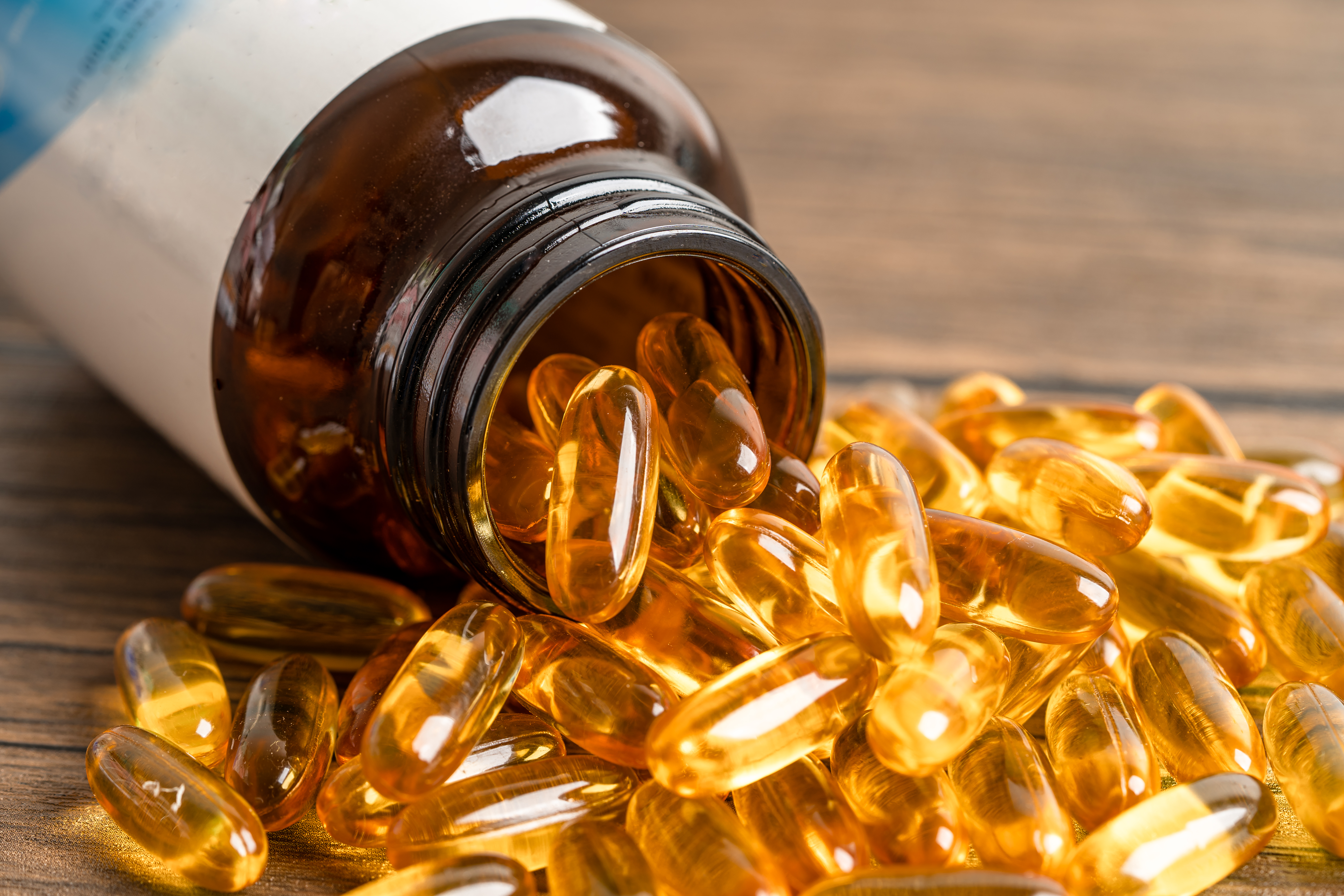 Bottle of omega-3 fish oil softgel supplements