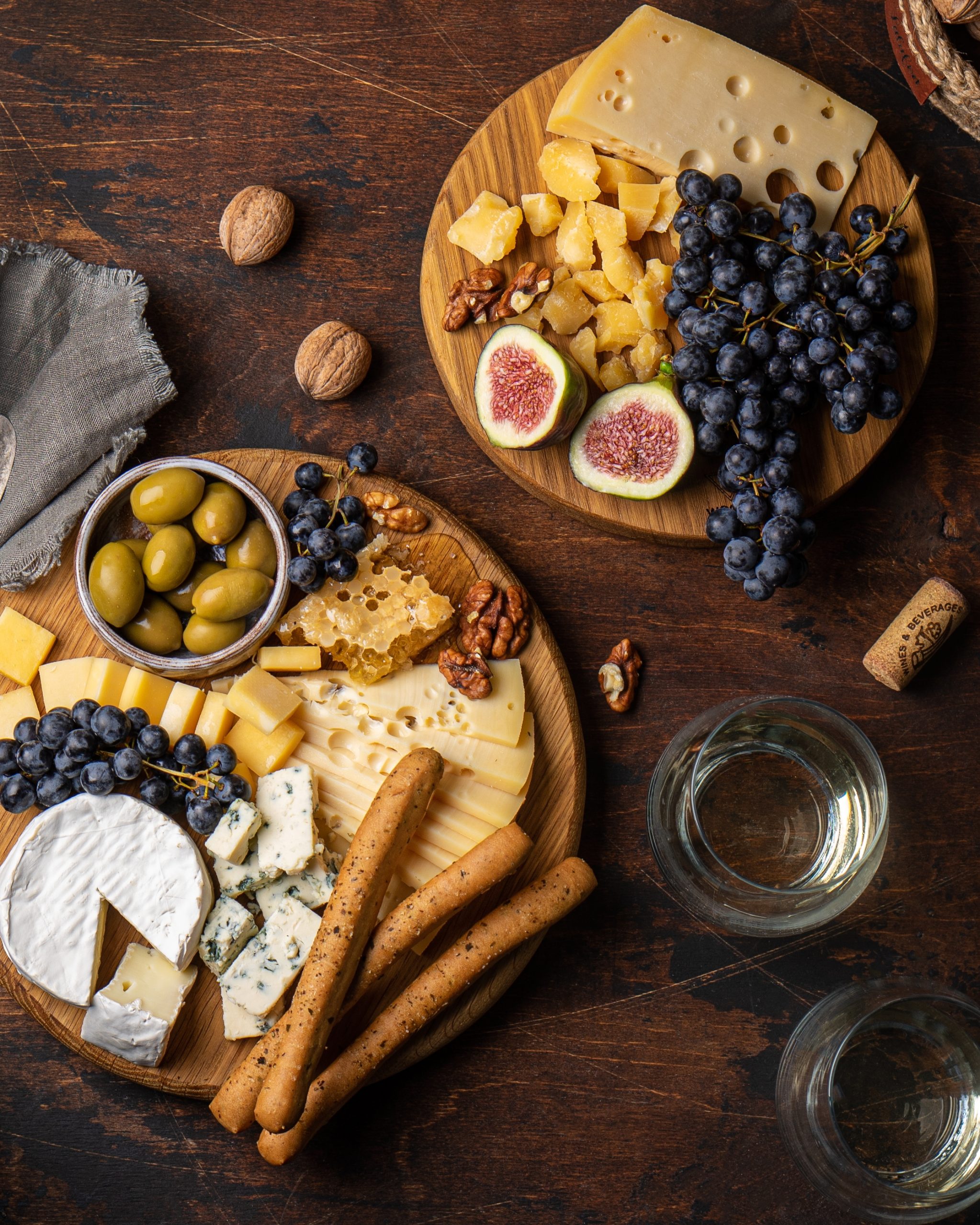 Cheese and fruit platter on a wooden table