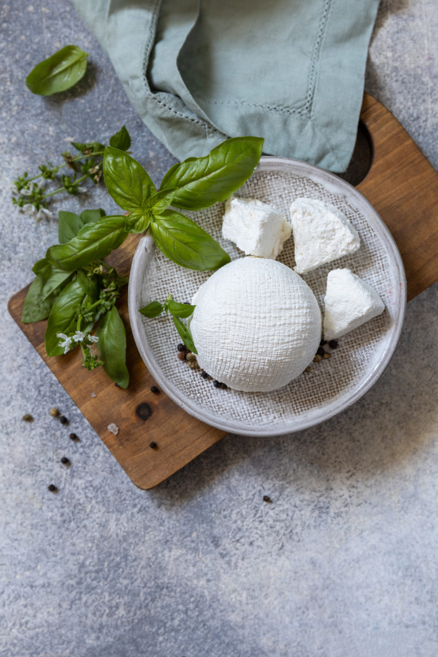 Fresh cheese with herbs on a plate