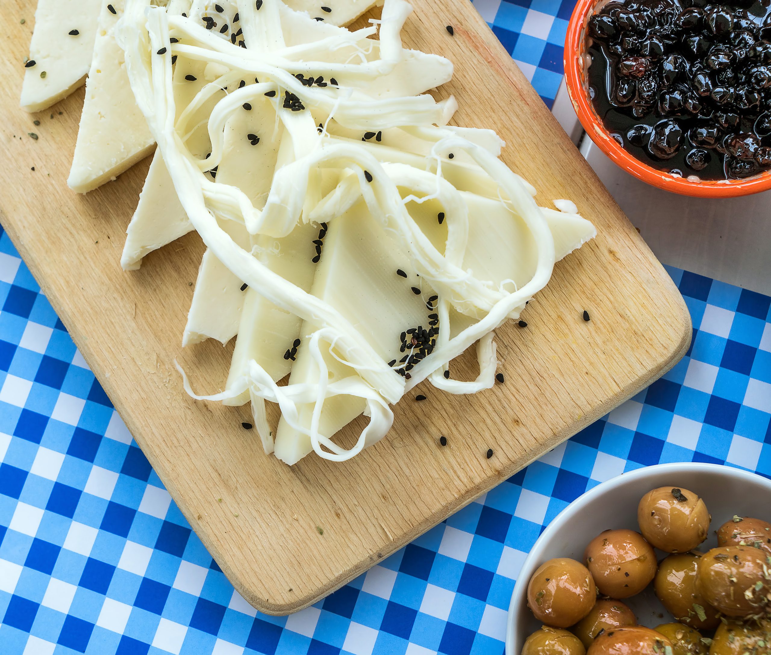 White cheeses, black seeds and olives at a Turkish breakfast